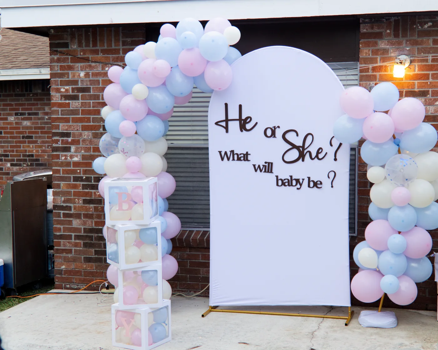A finished gender reveal setup, photographed wide